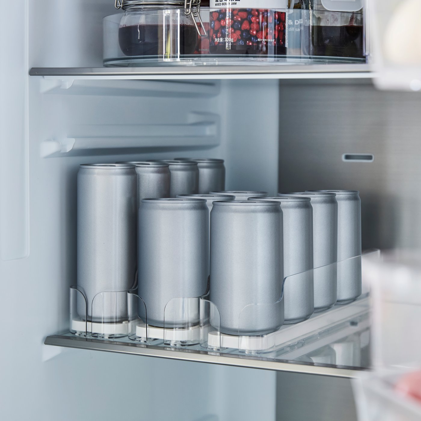 A transparent KLIPPKAKTUS drink holder for fridge