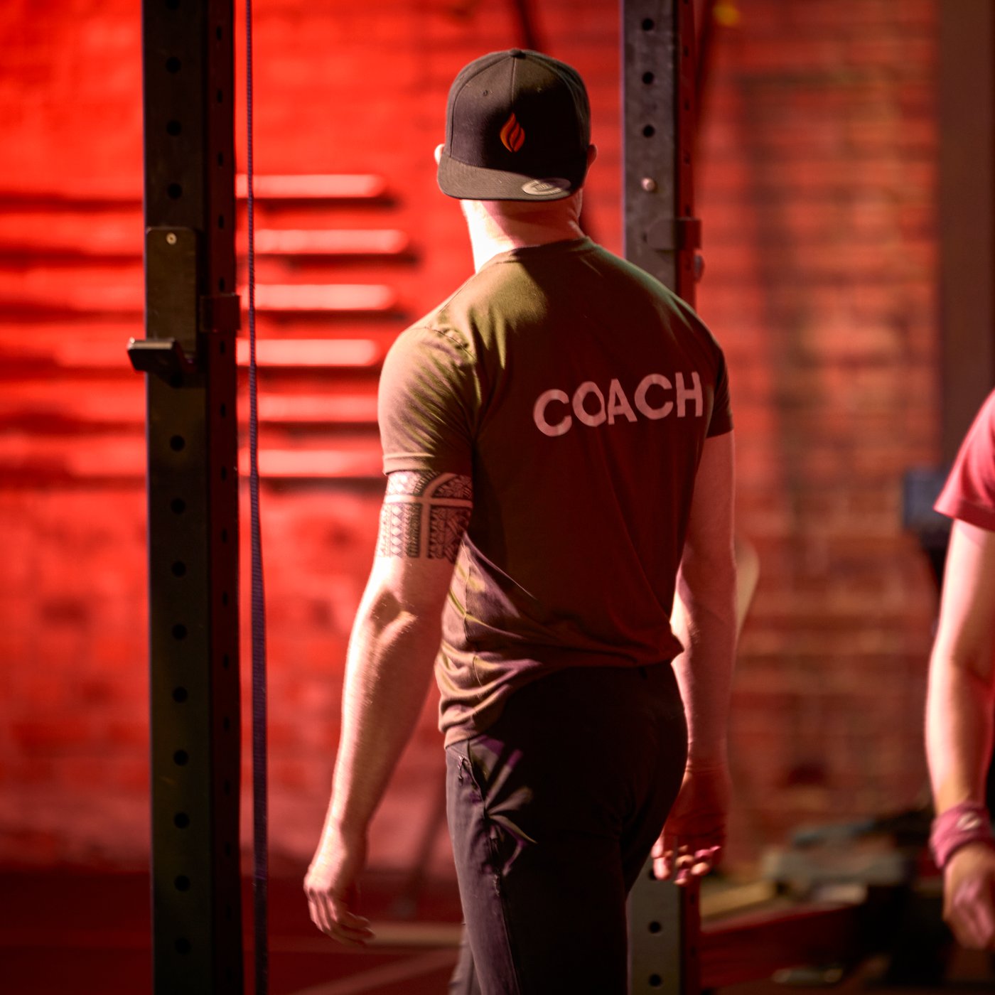 Man walking across a red-lit area