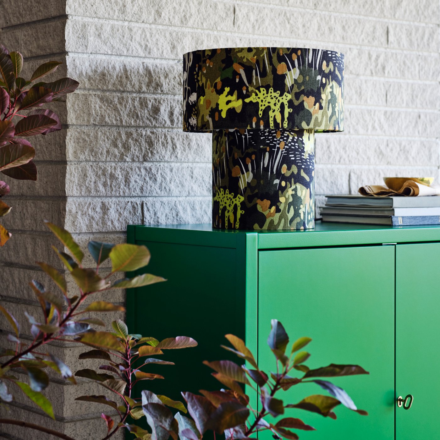 A green STOCKHOLM 2025 cabinet with 2 doors