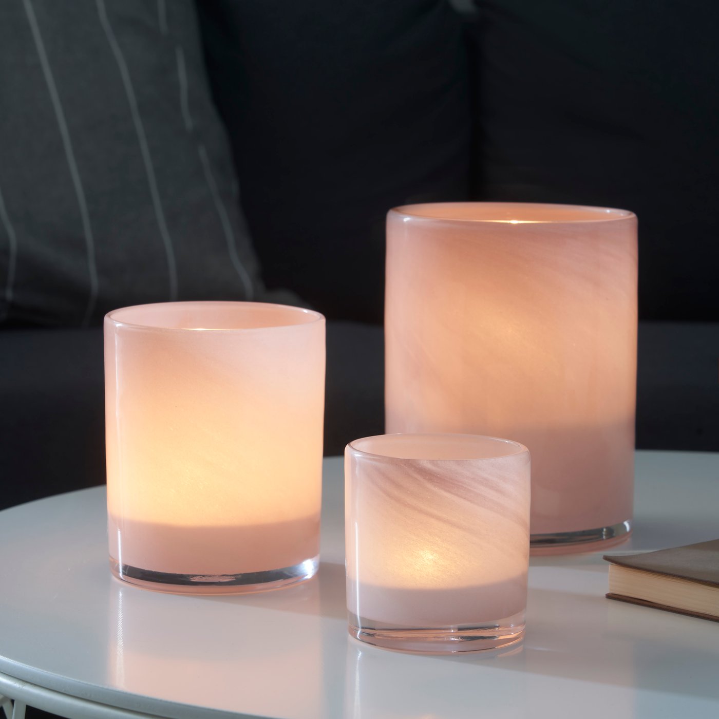 A pale pink VINDSTILLA tealight holder