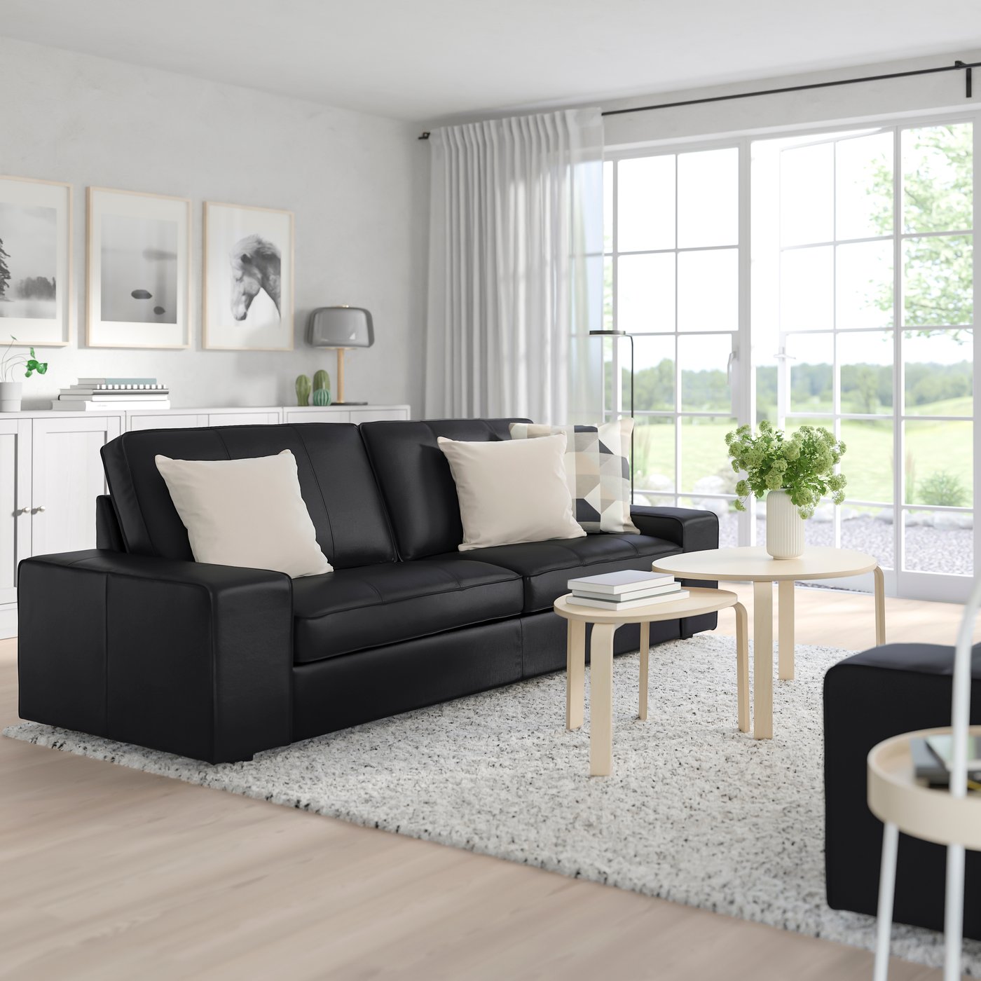 A Grann/Bomstad black KIVIK 3-seat sofa in the living room