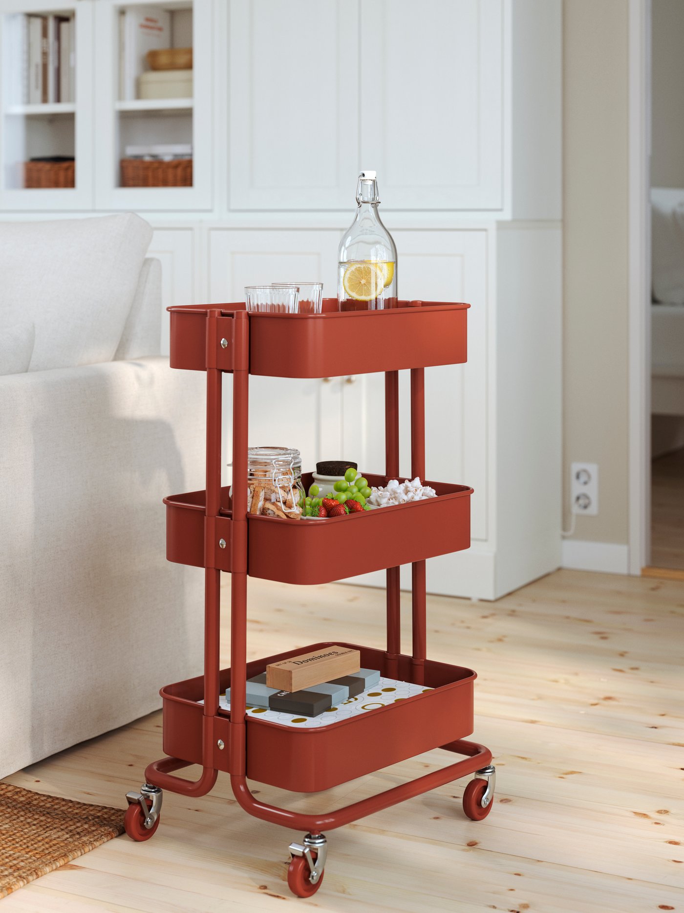 A red-brown RÅSKOG trolley