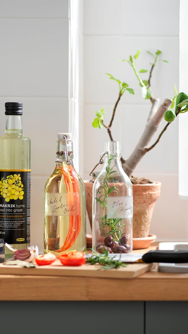 A clear glass KORKEN bottle with stopper