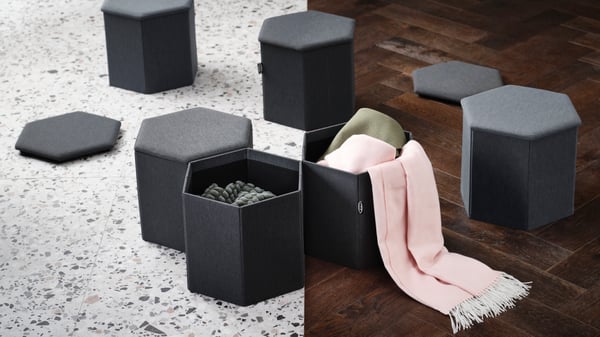 A Knisa dark grey KJUGE pouffe with storage