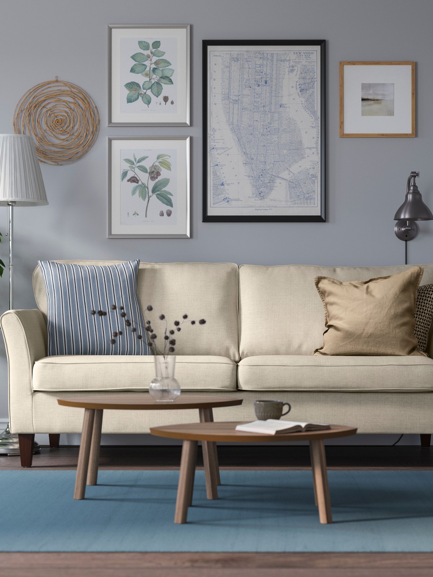 A nickel-plated/white ÅRSTID floor lamp in the living room