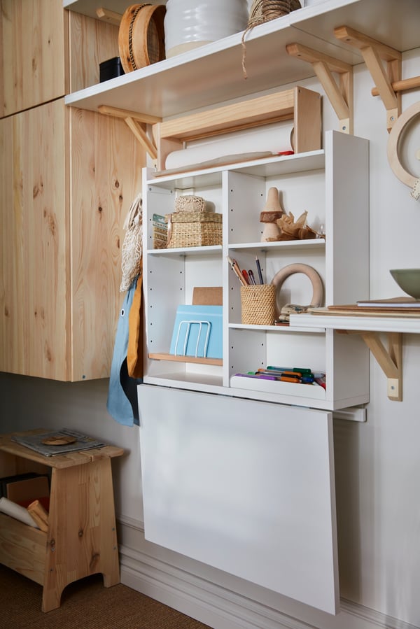 A NORBERG wall-mounted table with adjustable shelves and a folding table.

