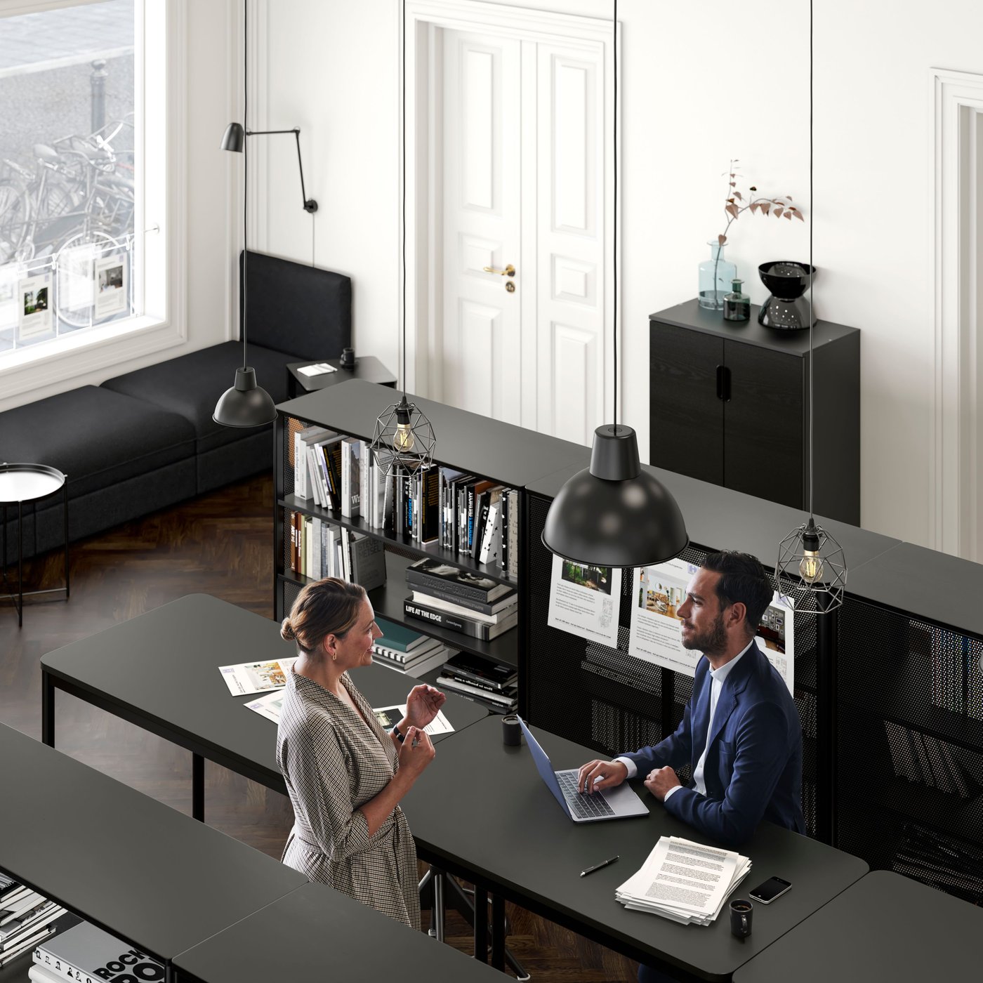 An IKEA co worker helping a customer 