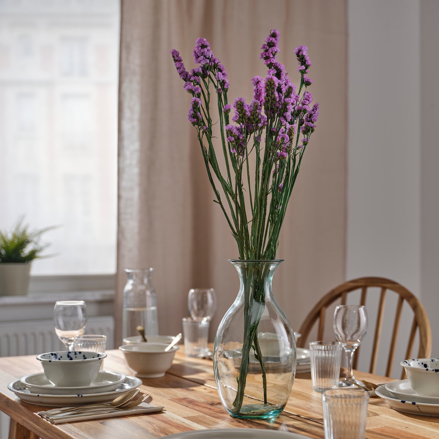Vase with dried flowers decorating a table