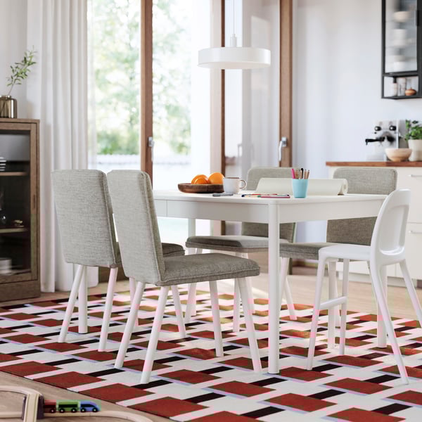 An off-white TONSTAD extendable table