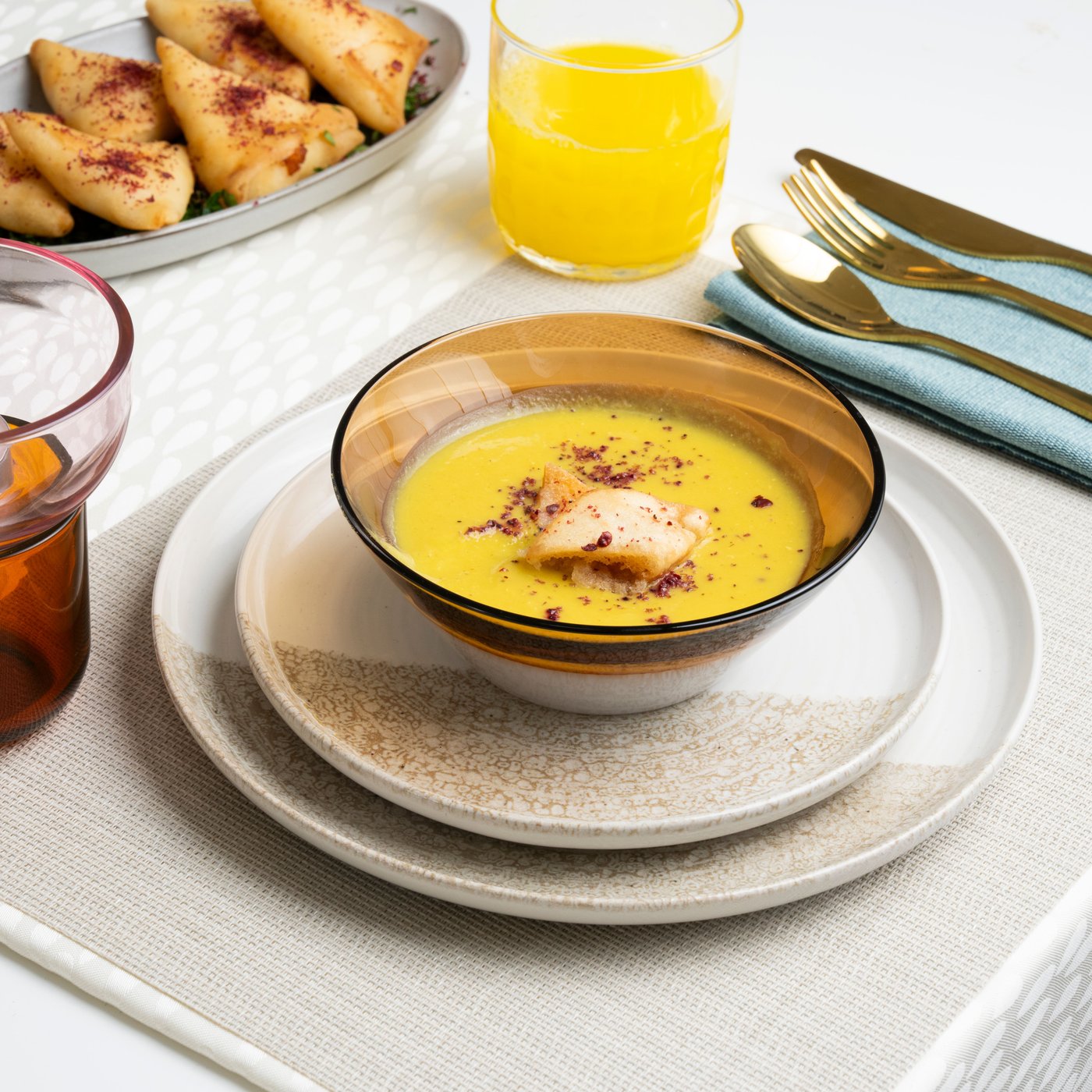 A patterned/light beige KRUSTISTEL side plate