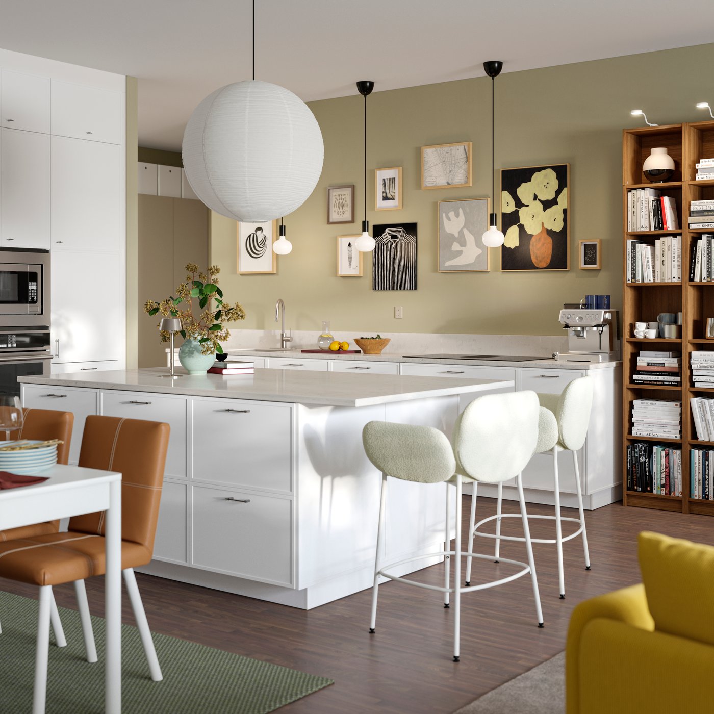A modern kitchen with white ASPUDDEN fronts featuring a kitchen island and SYNTORP bar stools connecting to the living room.