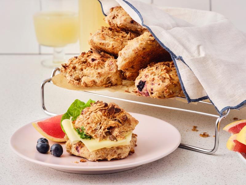 Breakfast buns with overnight granola on a plate with blueberries.