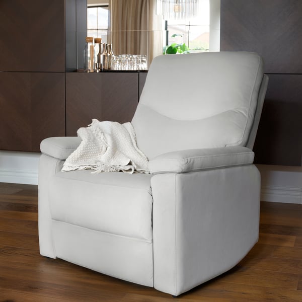 A SKULNÄS recliner chair placed in front of wall-mounted cabinets arranged to frame a surface for refreshments at its centre.