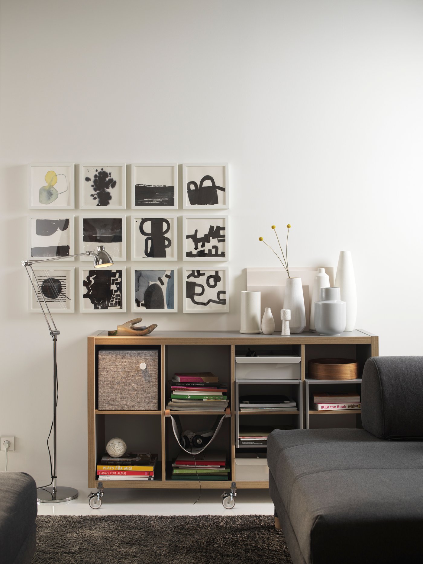 A grey/wood effect KALLAX shelving unit in the living room