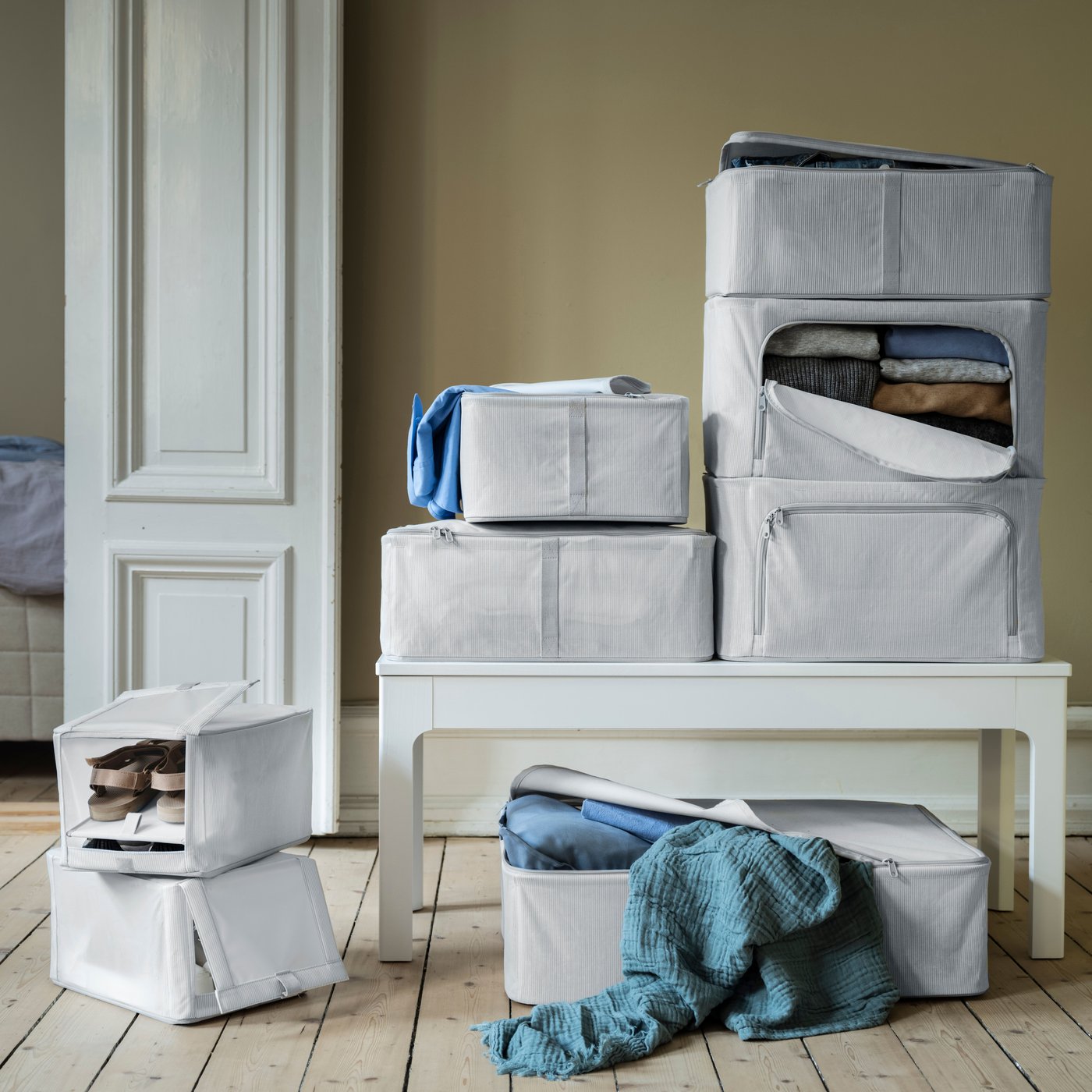 A fabric striped/white/grey HEMMAFIXARE storage case in the NA