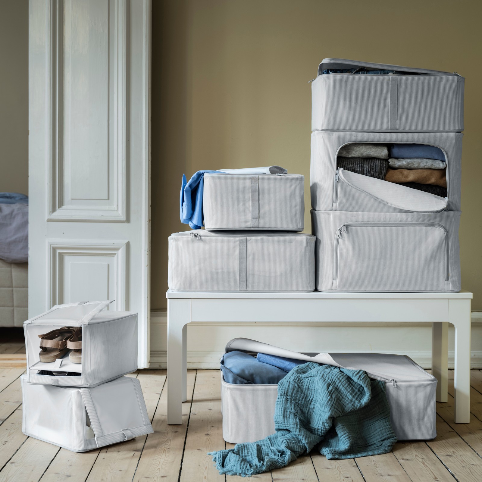 A fabric striped/white/grey HEMMAFIXARE storage case in the NA