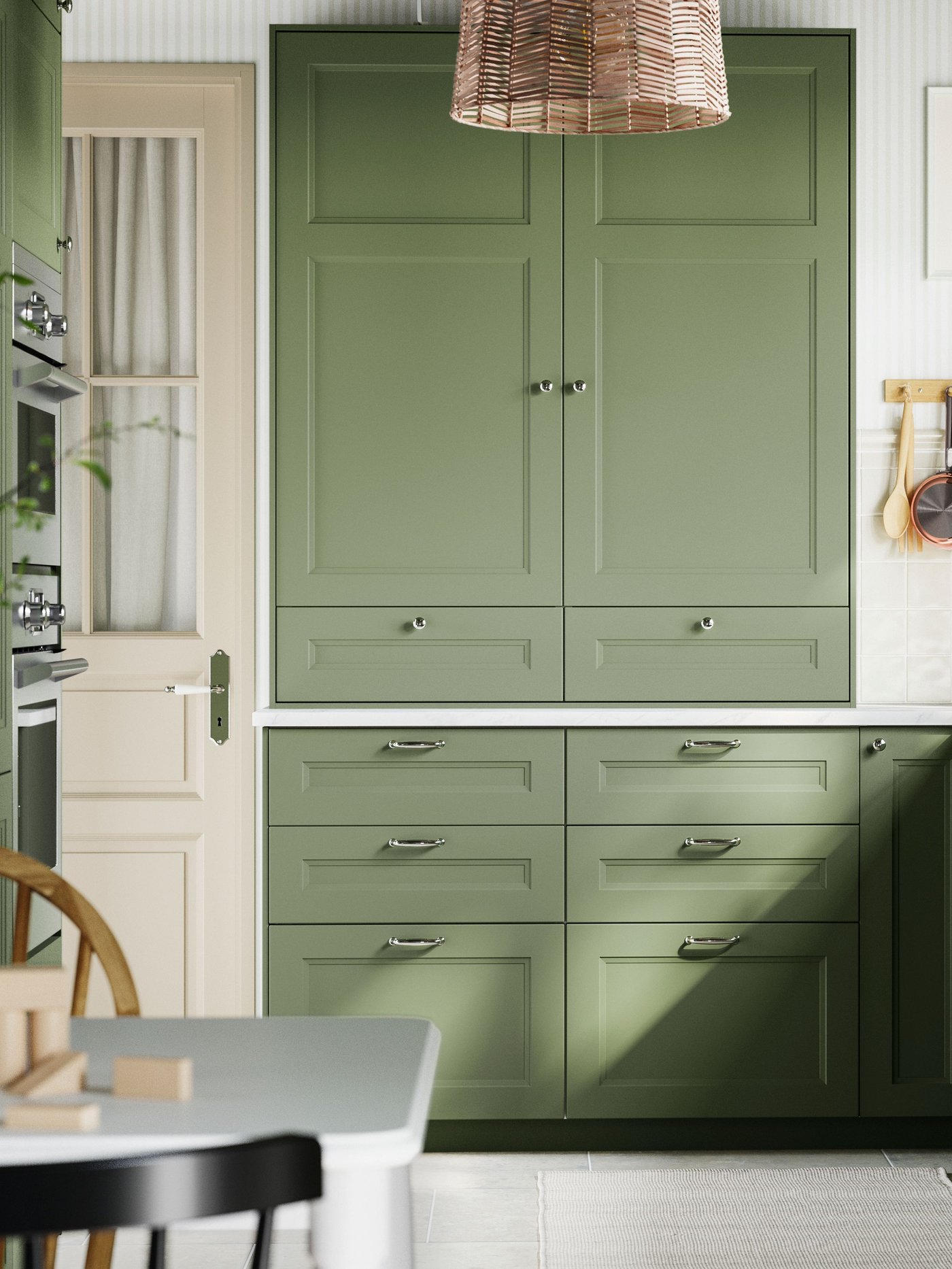 A grey-green AXSTAD door in the kitchen