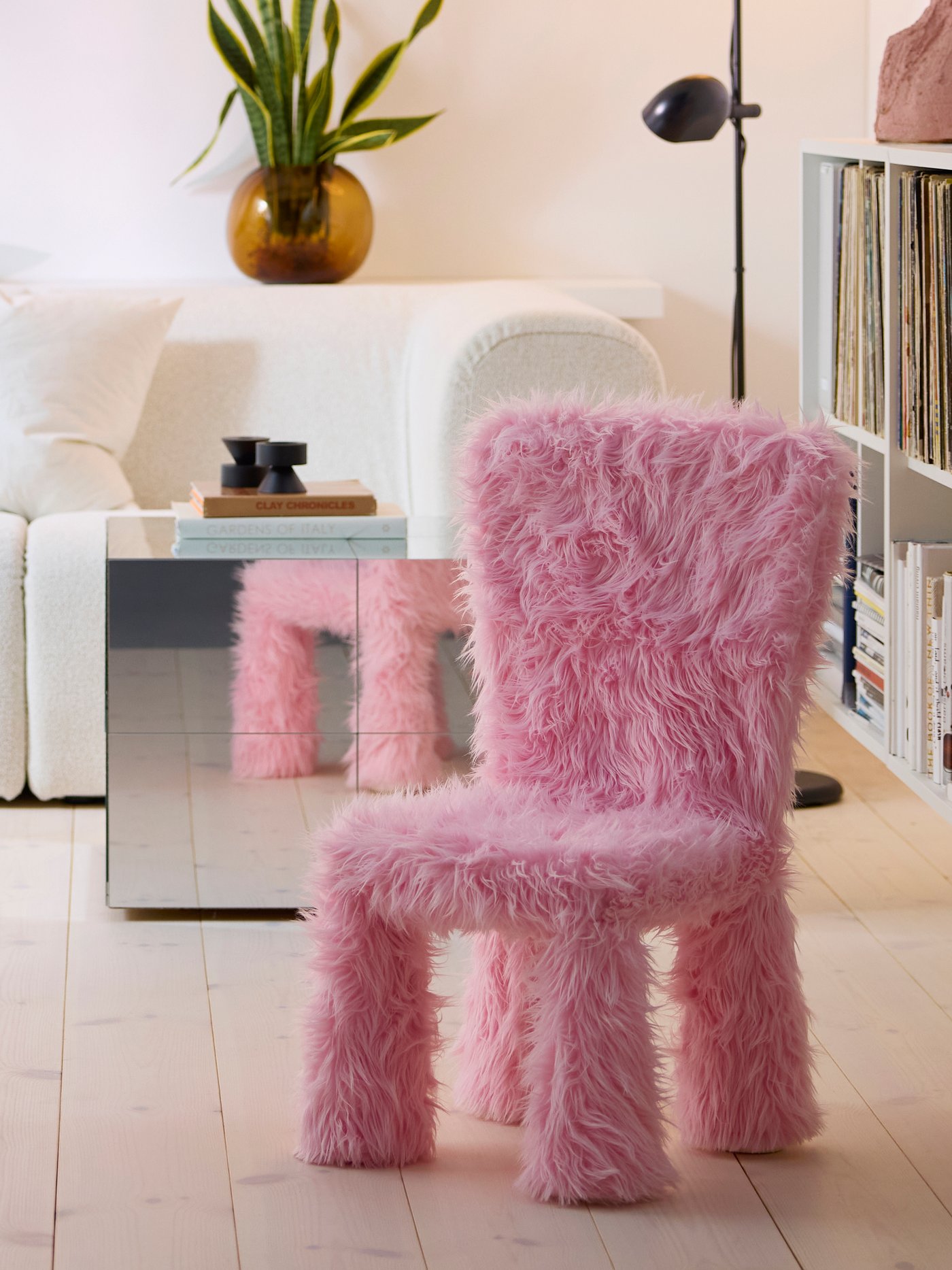 A fluffy pink chair in the living room
