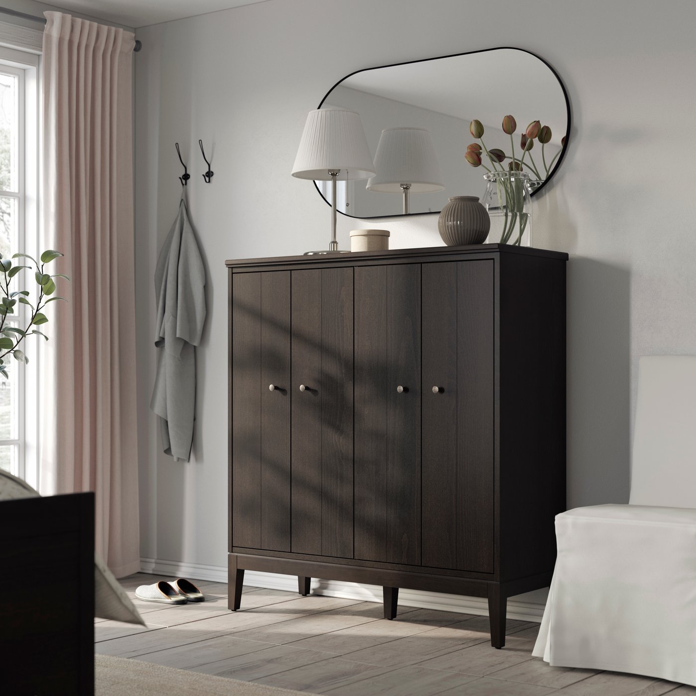 A dark brown stained IDANÄS cabinet with bi-folding doors