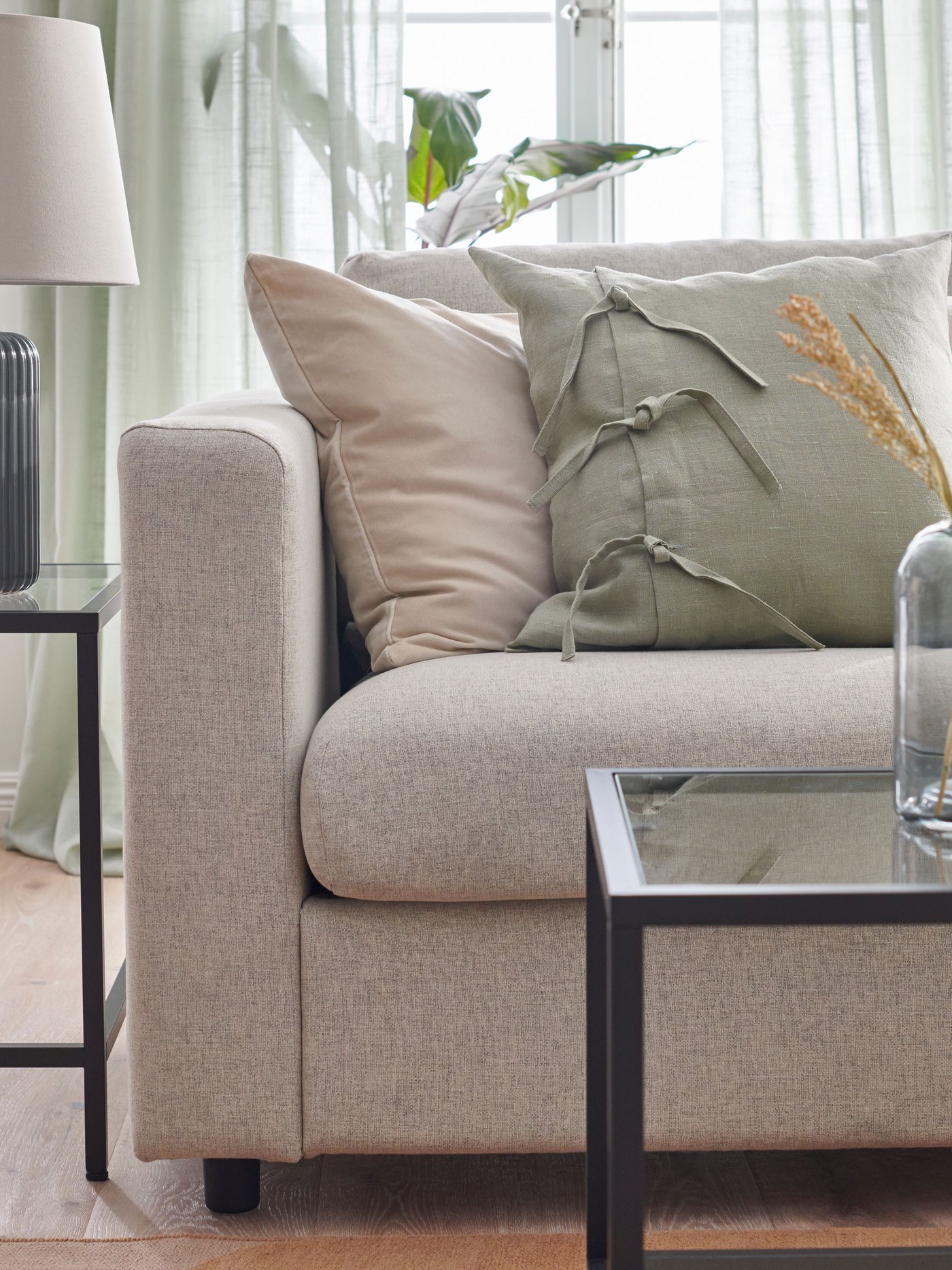 A beige RÖDASK cushion cover in the living room