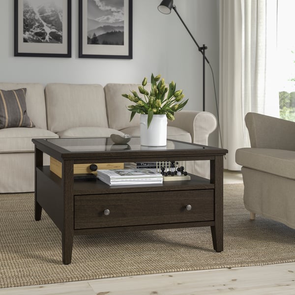 A dark brown stained IDANÄS coffee table