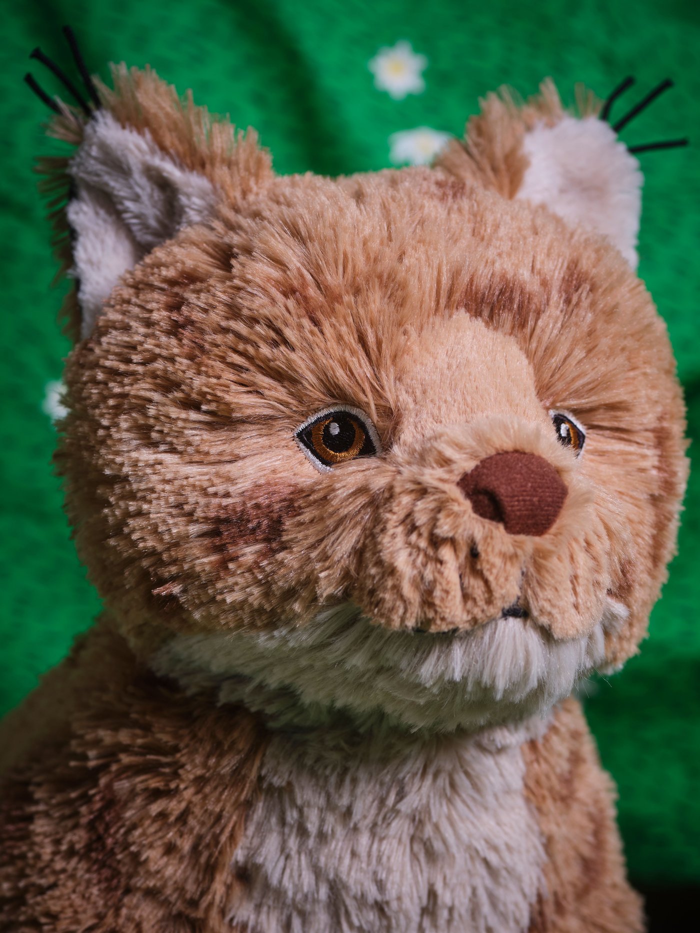 A lynx/orange brown SKOGSDUVA soft toy
