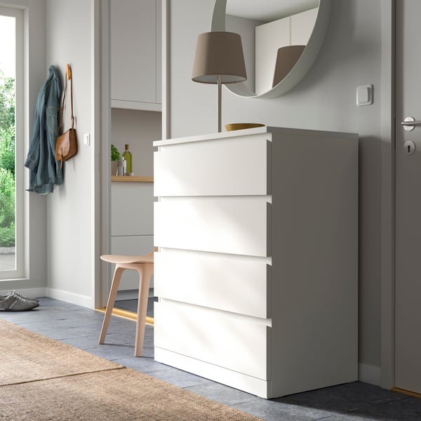 A white MALM chest of 4 drawers