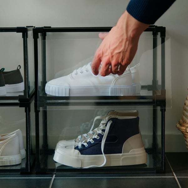 A transparent SKUFFEN shoe box