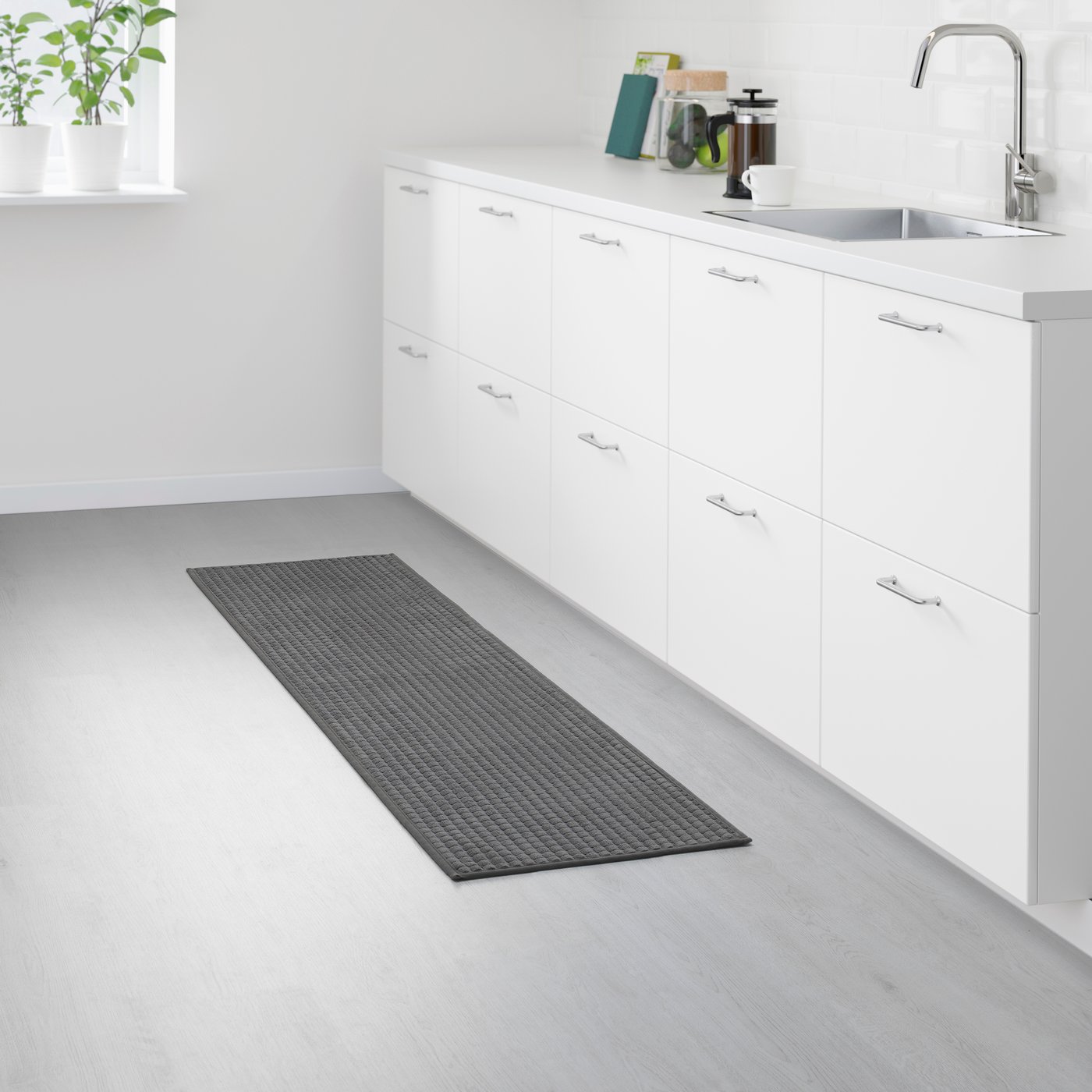 A grey BRYNDUM kitchen mat