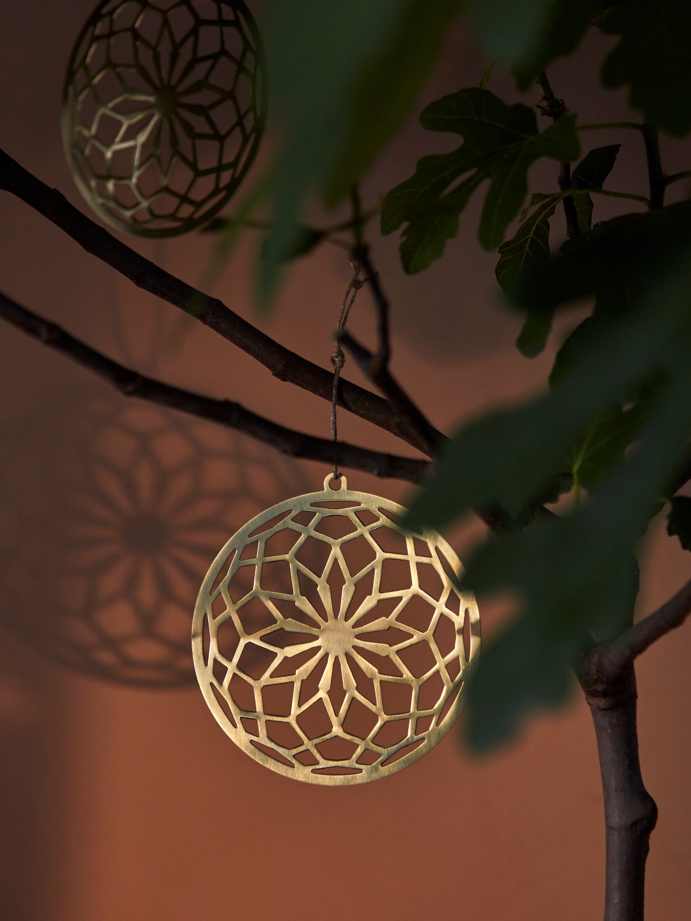 A gold-colour GOKVÄLLÅ hanging decoration