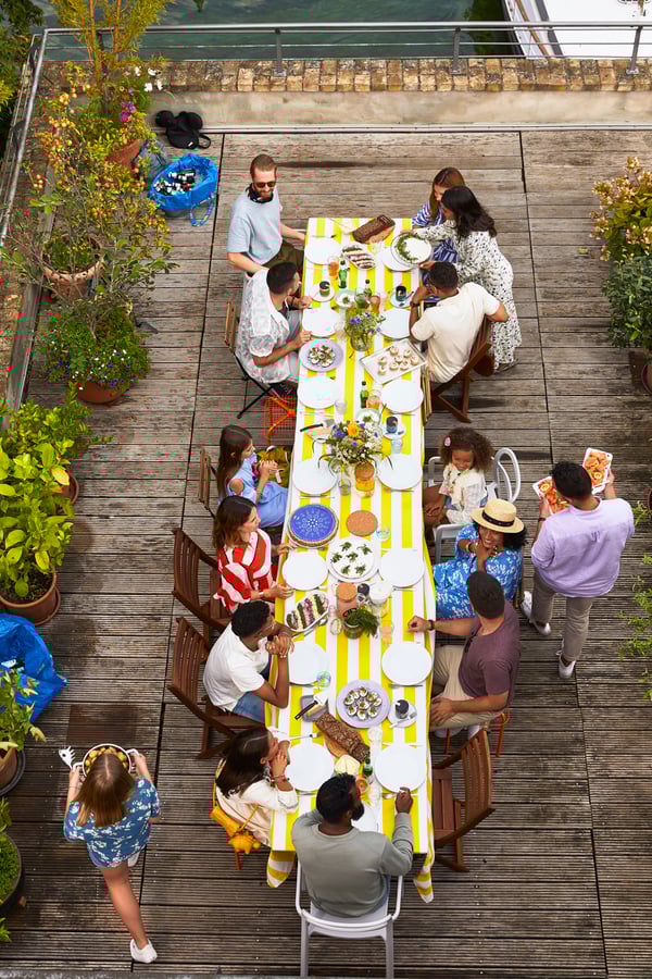 Many people seated at a long table