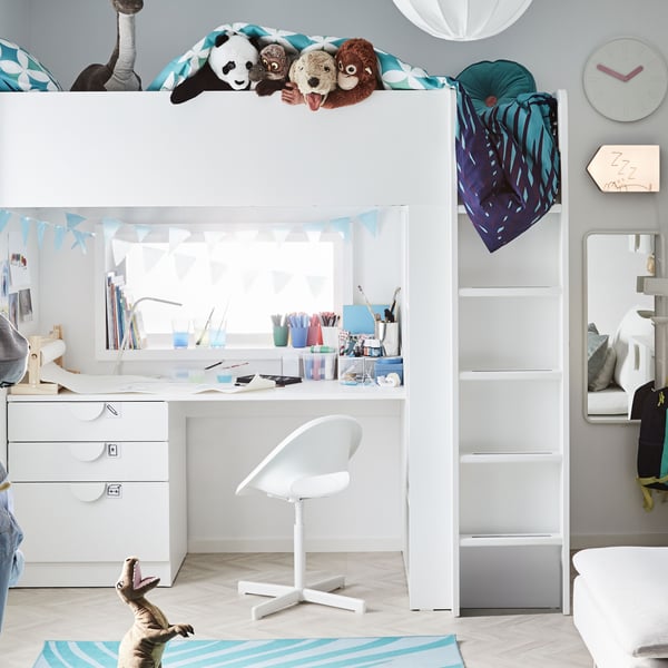 A panda DJUNGELSKOG soft toy in the bedroom