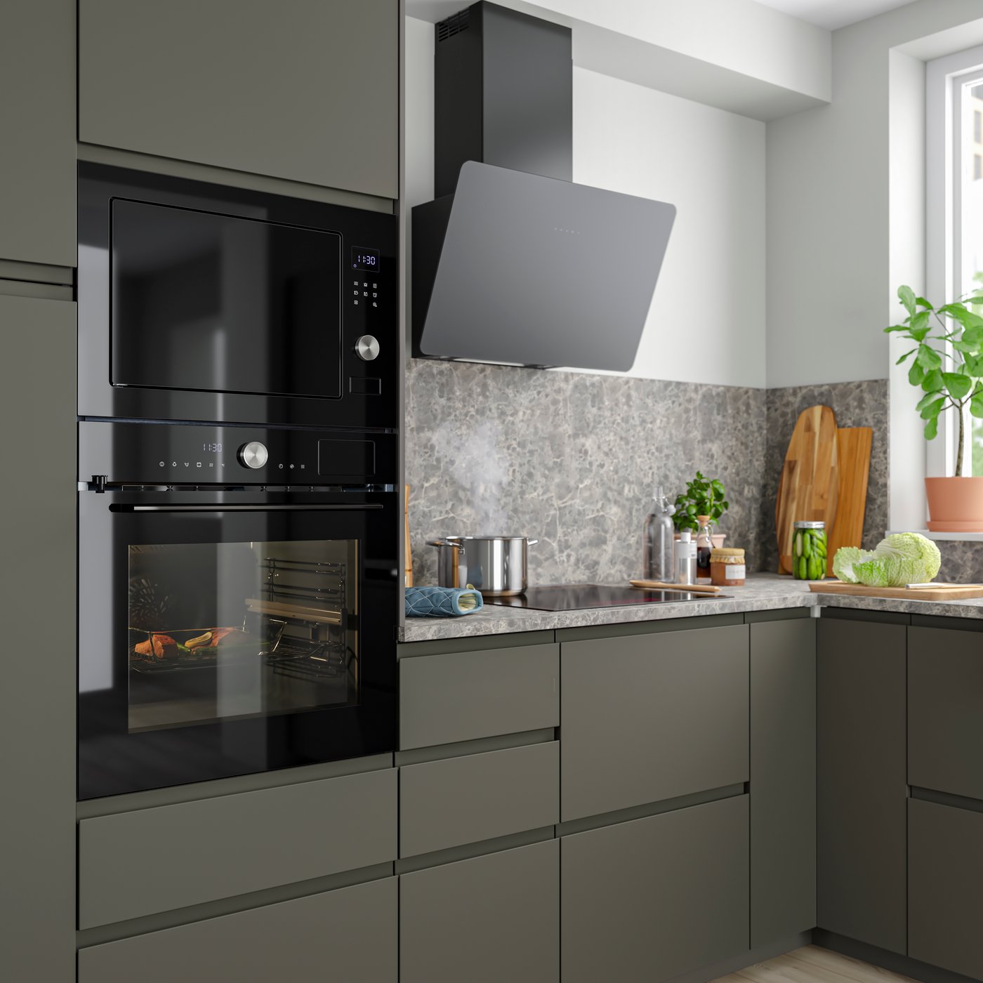 Cuina amb mobles baixos en acabat VOXTORP gris i campana extractora negra.