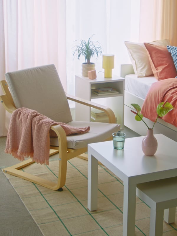 A light pink HORNMAL throw