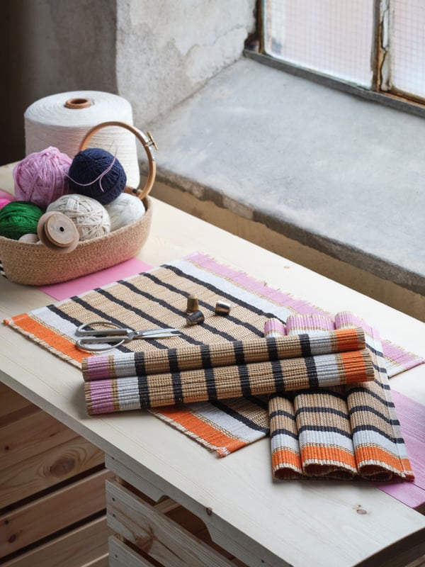 A banana fibre/stripe pattern MÄVINN place mat.