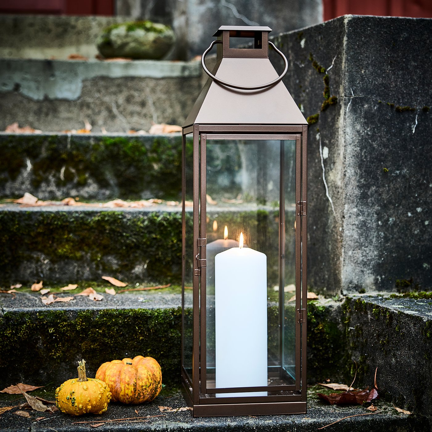 A white FENOMEN unscented pillar candle in the dining room