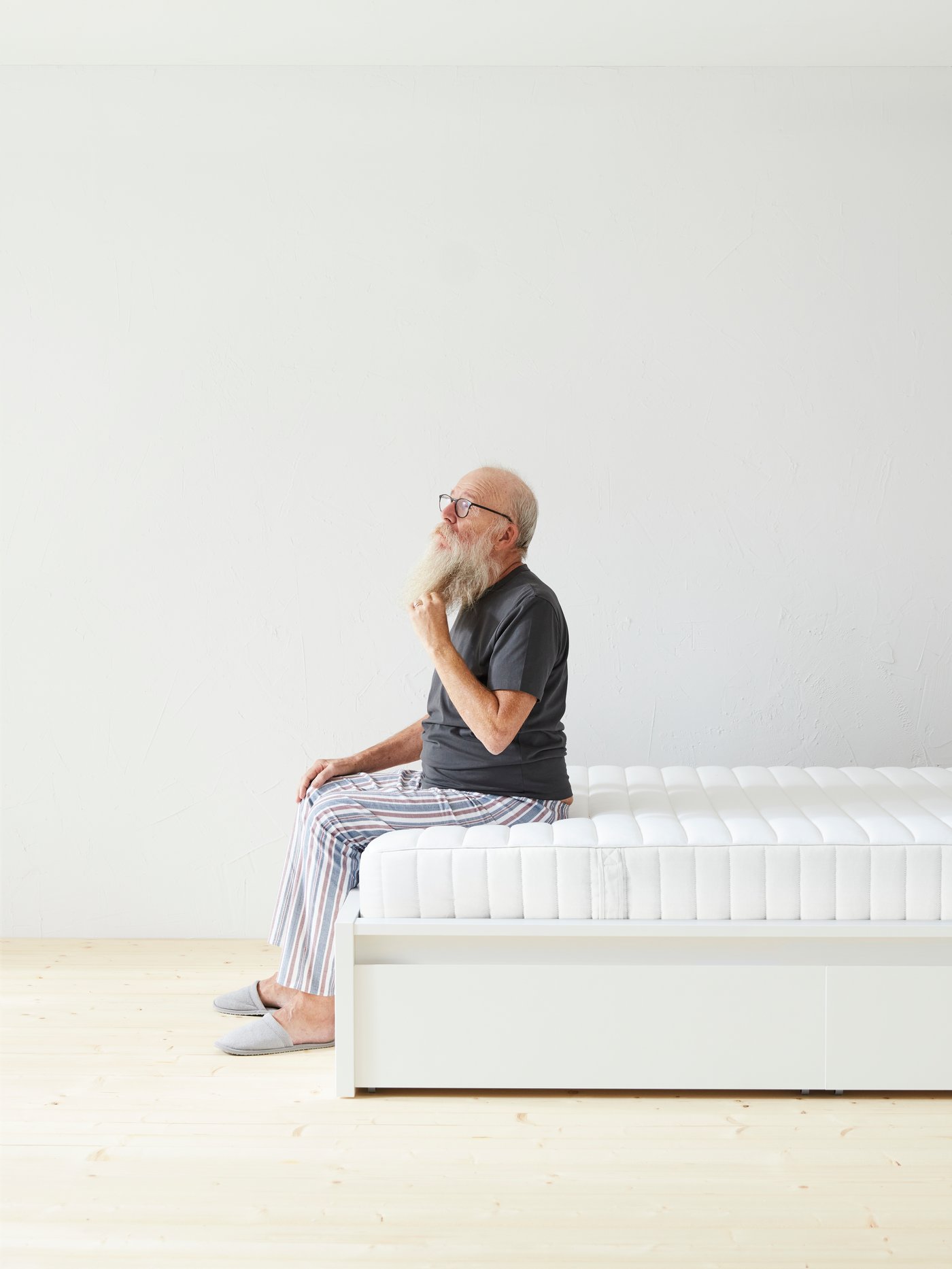 A firm/white VALEVÅG pocket sprung mattress