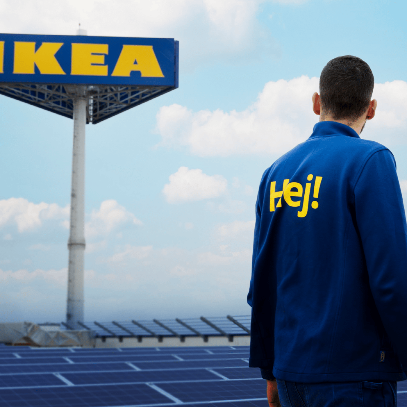 IKEA Co-worker in front of solarpanels and big IKEA-sign.