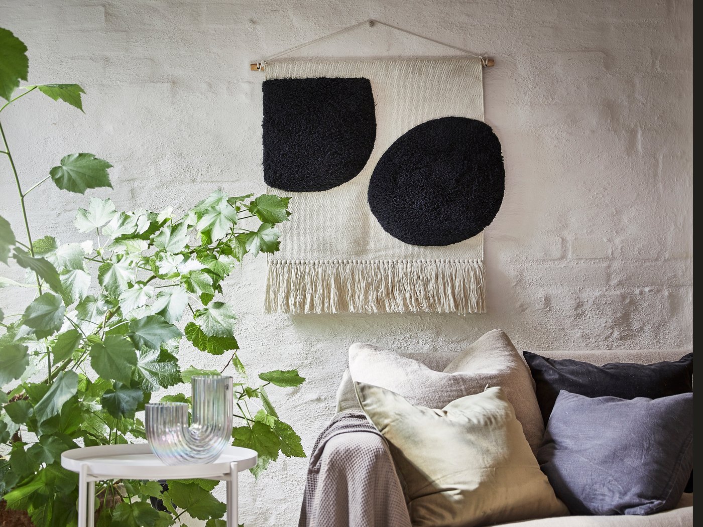 A BLANDSKOG decorative rug on the wall