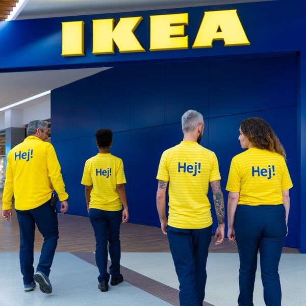 IKEA co-workers walking towards an IKEA store.