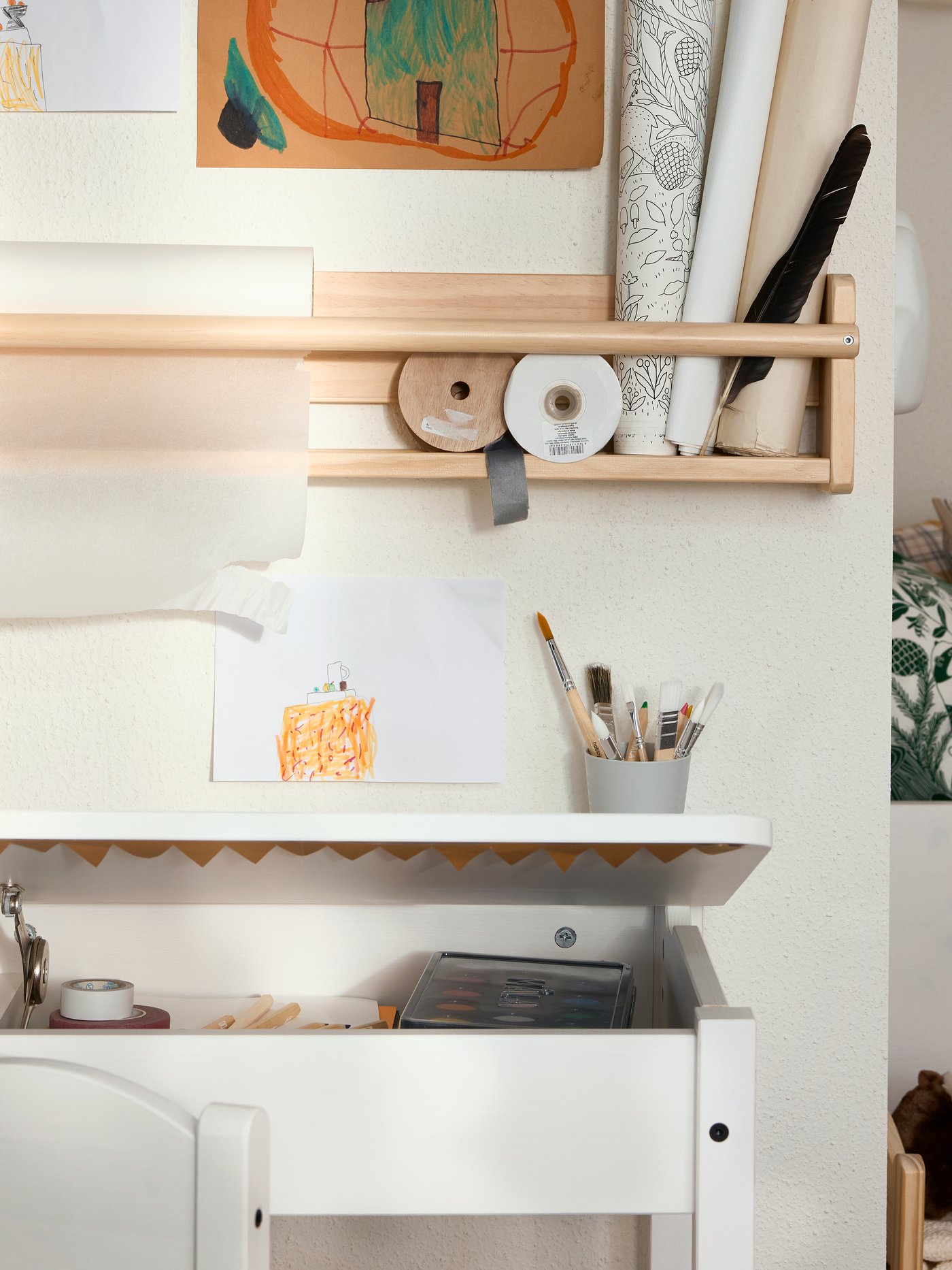 Close-up of SUNDVIK children’s desk with the lid open to show storage inside, FLISAT wall storage above the desk.
