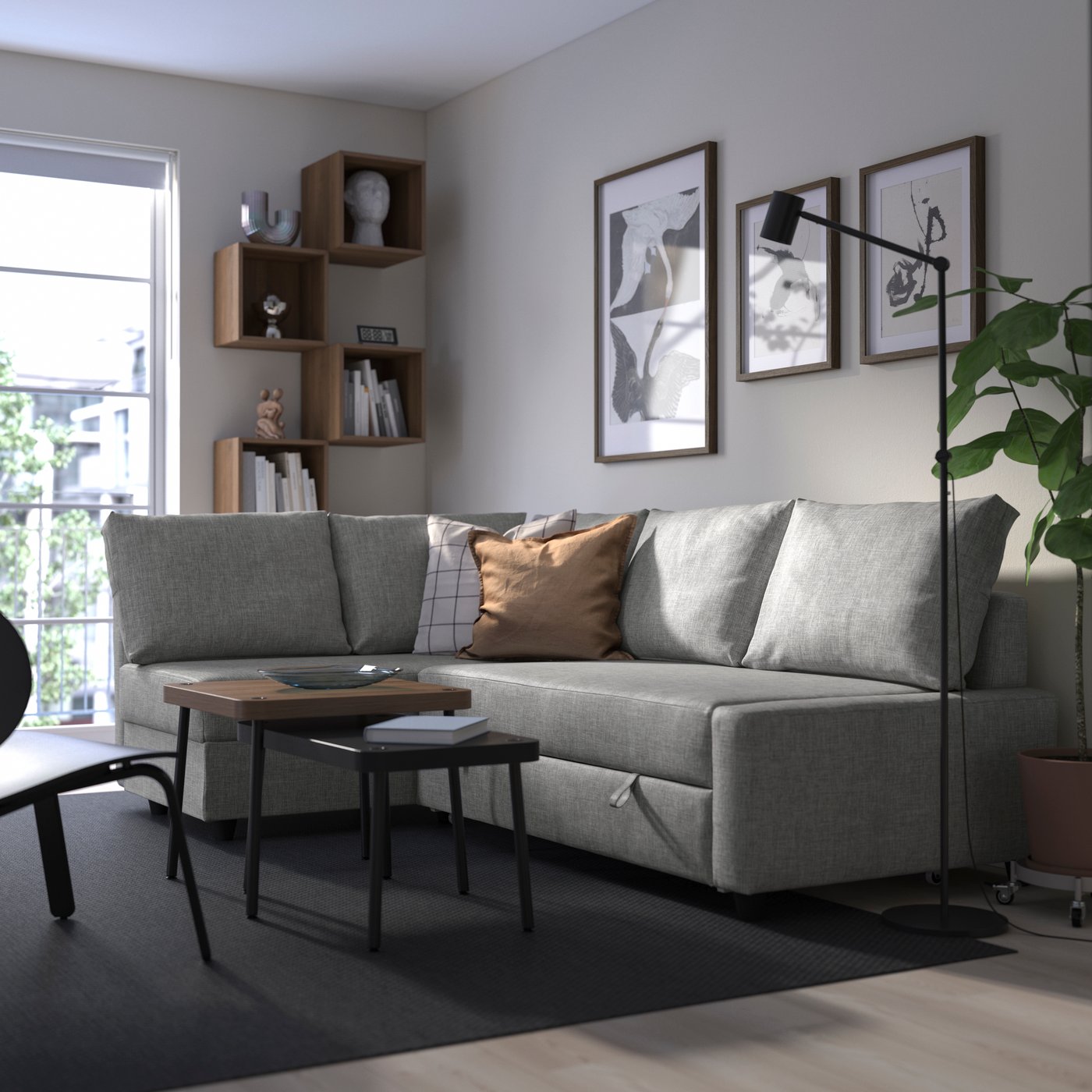 A Faringe light grey FRIHETEN seat section for corner sofa-bed in the living room