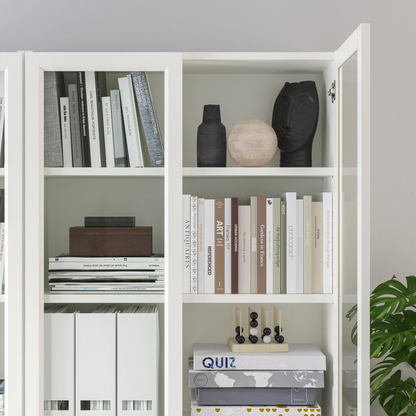 A white/glass BILLY bookcase with panel/glass doors