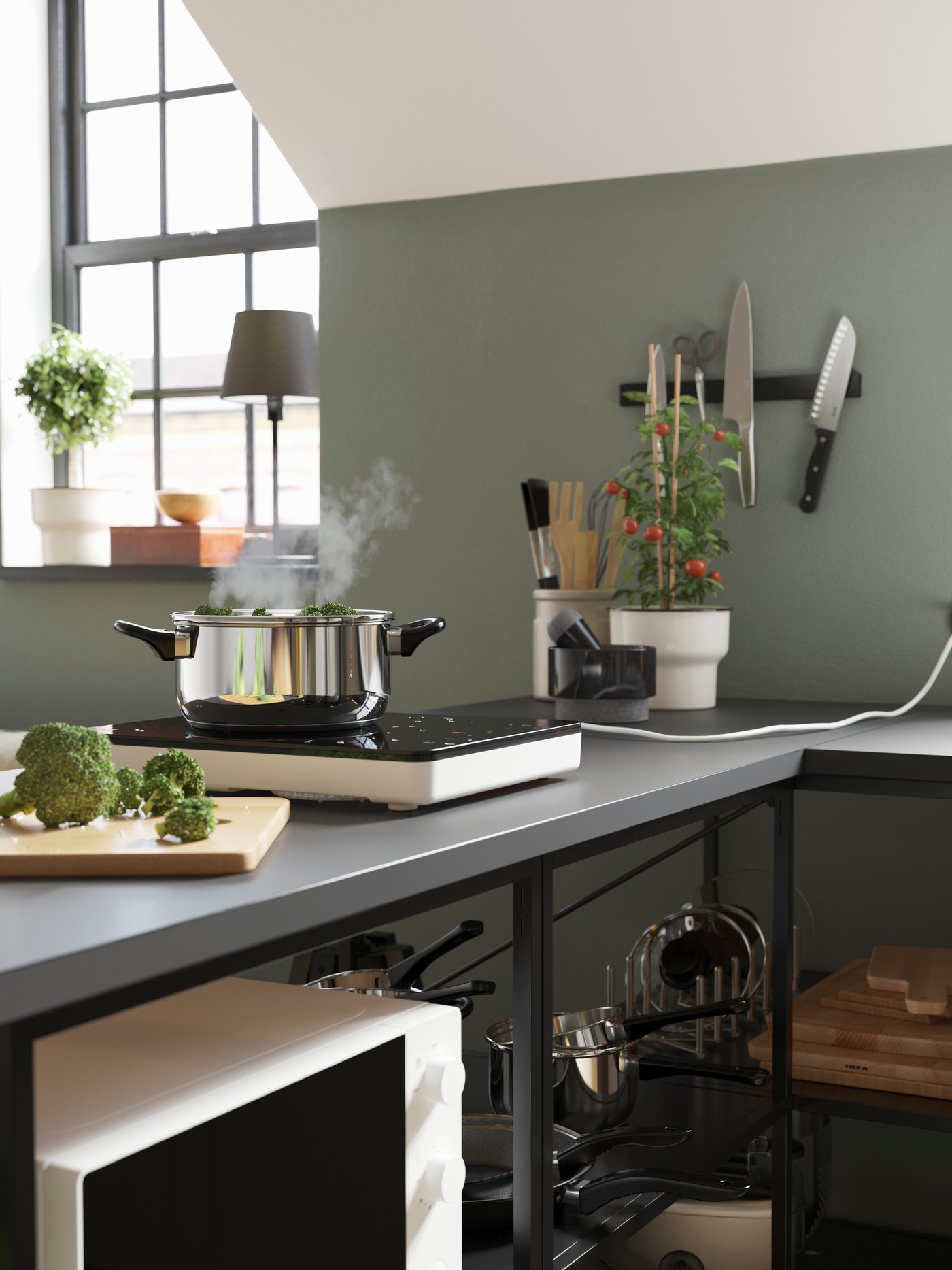 A white TILLREDA portable induction hob in the kitchen