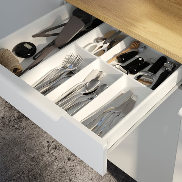 A white STÖDJA cutlery tray in the kitchen