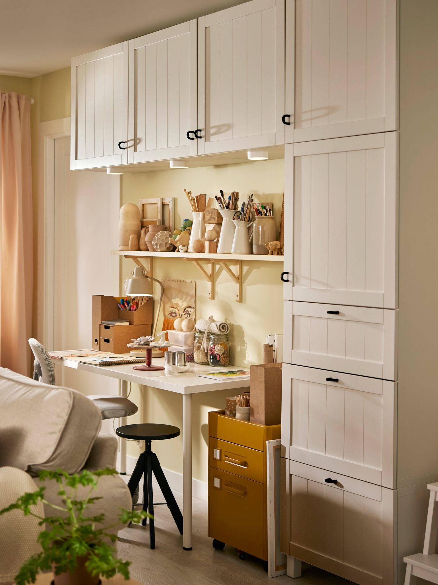 BESTÅ storage is mounted on the wall around a LAGKAPTEN / ADILS desk and two TRANHULT / SANDSHULT wall shelves.