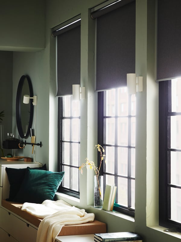 Smart and electric blinds in a room with a green hue