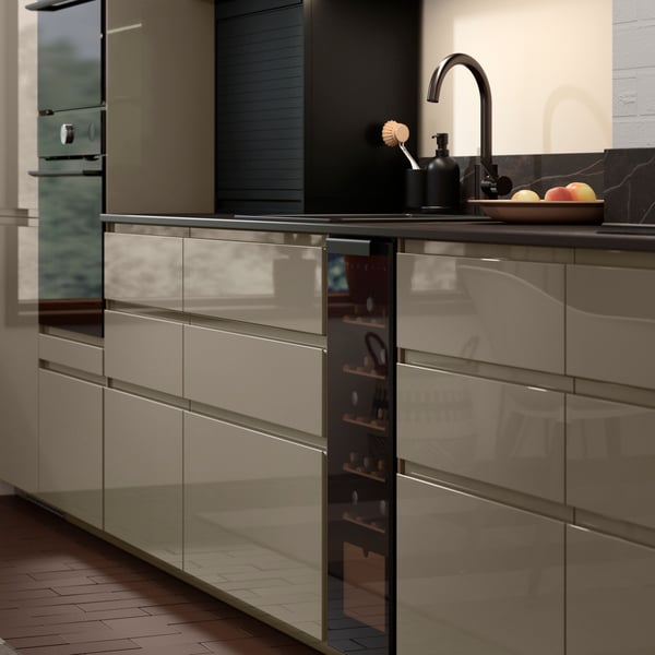 A black GANSJÖN 3-piece bathroom set in the kitchen