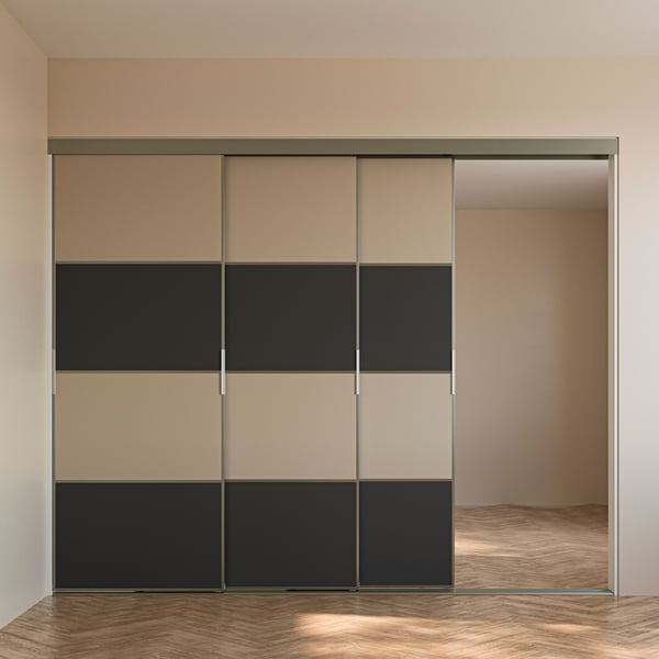A SKYTTA sliding door solution with low sliding door frames and dark grey/grey-beige MEHAMN panels for sliding door frame.