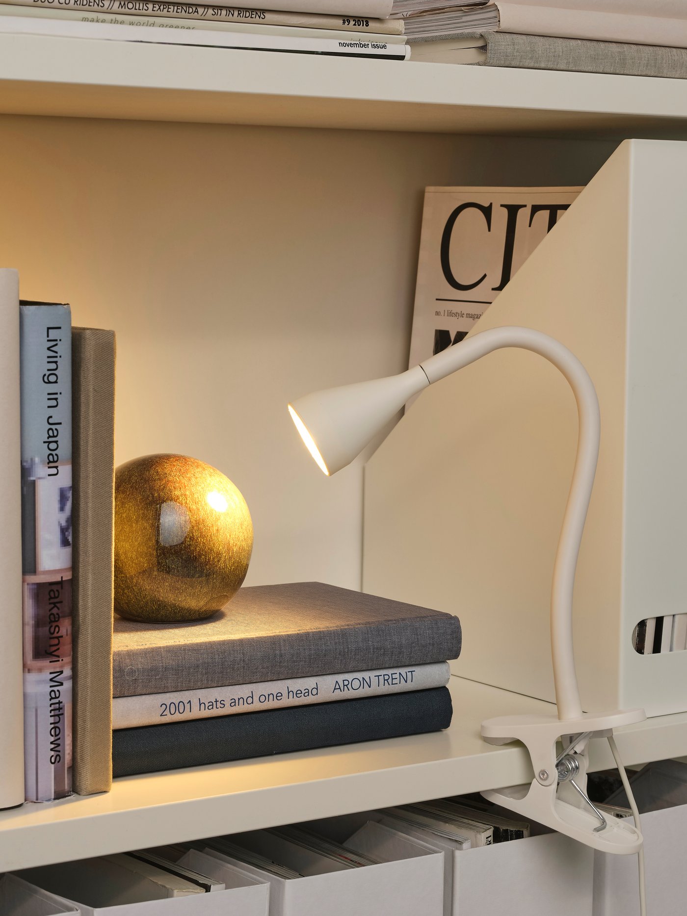 A white NÄVLINGE LED clamp spotlight